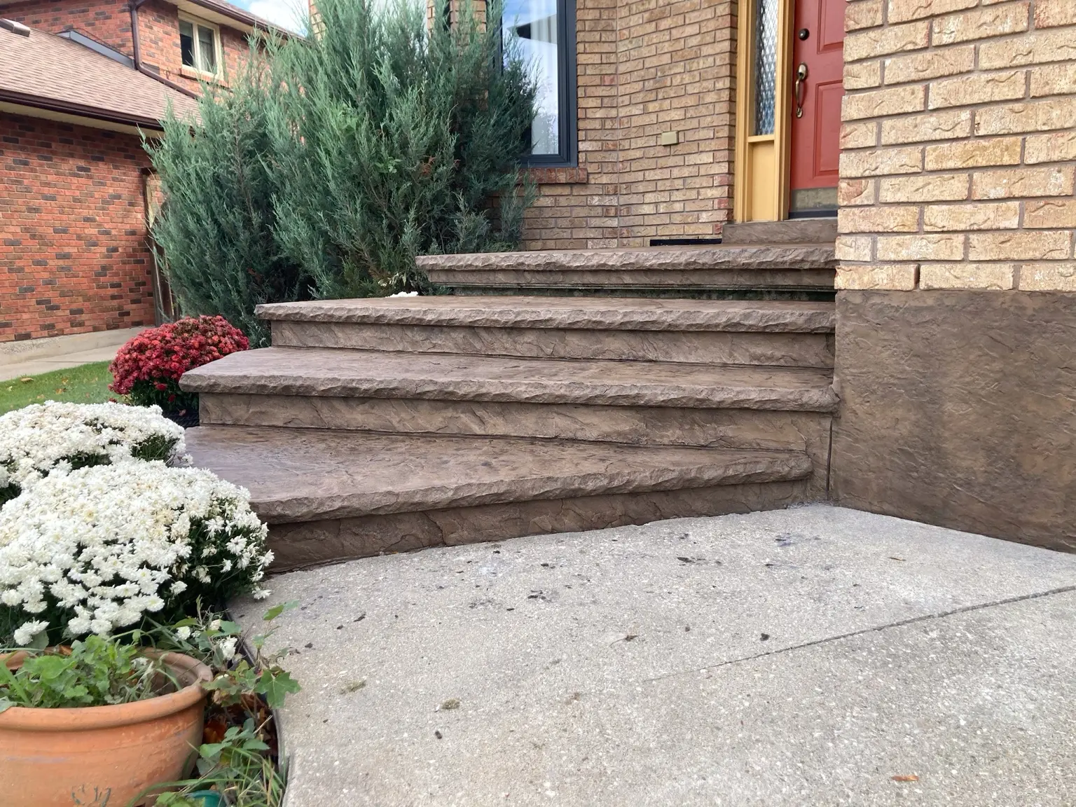Textured concrete overlay on entrance steps