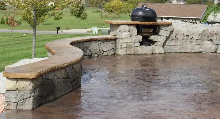 Custom curved outdoor cooking and seating feature